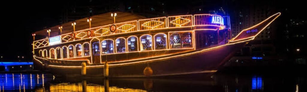 Couple enjoying the view from the deck of the Dubai Canal Cruise.