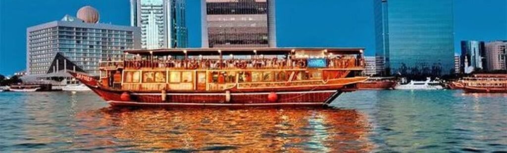 Guests enjoying drinks on the Dubai Marina Sunset Cruise.