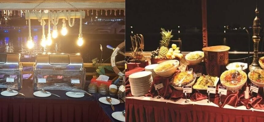 Dhow Dinner Cruise at Dubai Creek › Forever Tourism LLC Dhow boat illuminated at night on Dubai Creek.