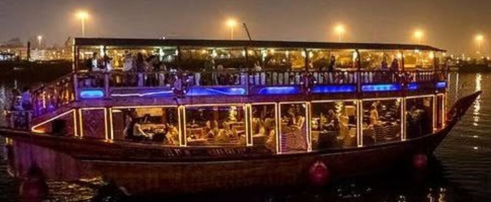 Traditional dhow sailing through Dubai Creek.