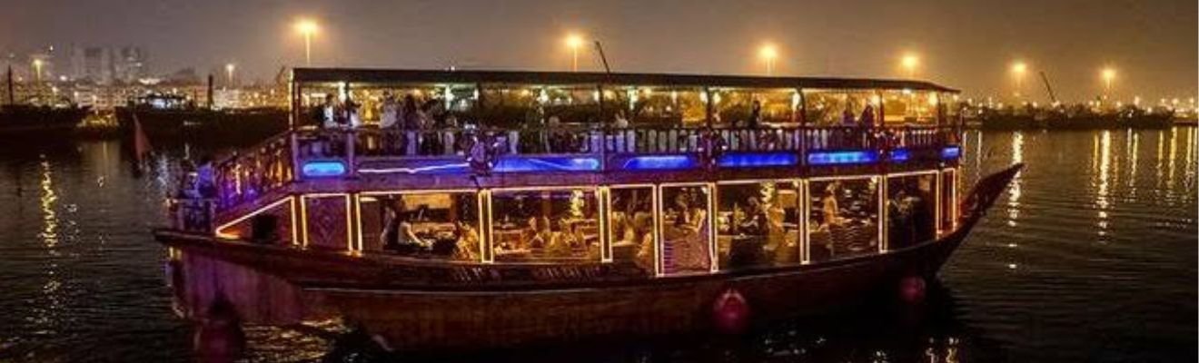 Traditional dhow sailing through Dubai Creek.