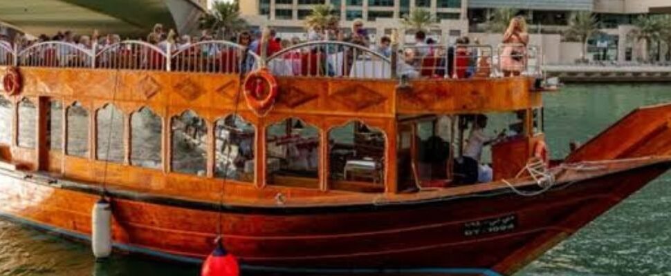 A luxury boat cruising through Dubai Marina.