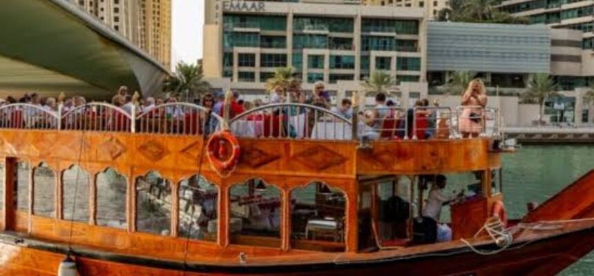Traditional dhow boat cruising on Dubai’s waters during brunch.