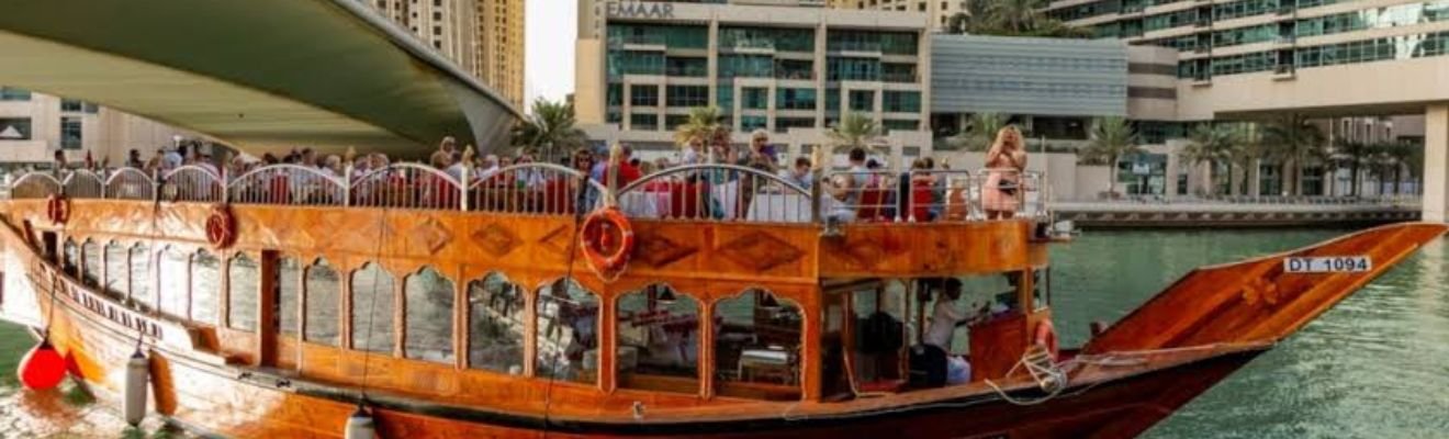 Traditional dhow boat cruising on Dubai’s waters during brunch.