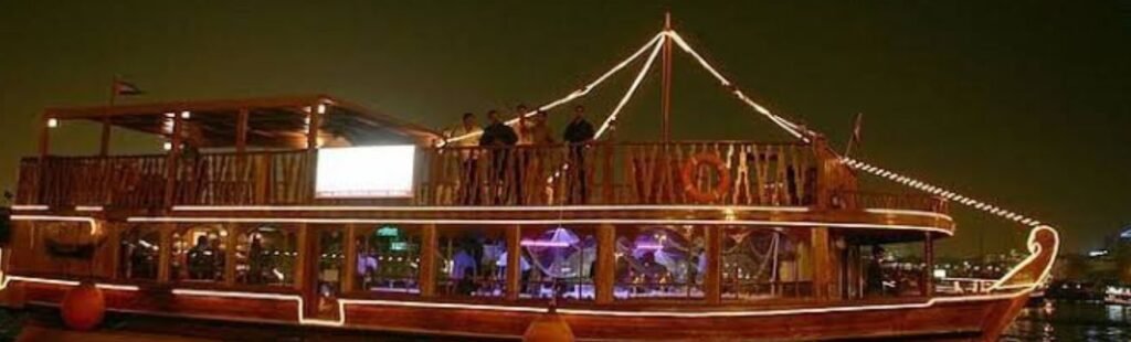 Guests enjoying a gourmet dinner on a dhow cruise.