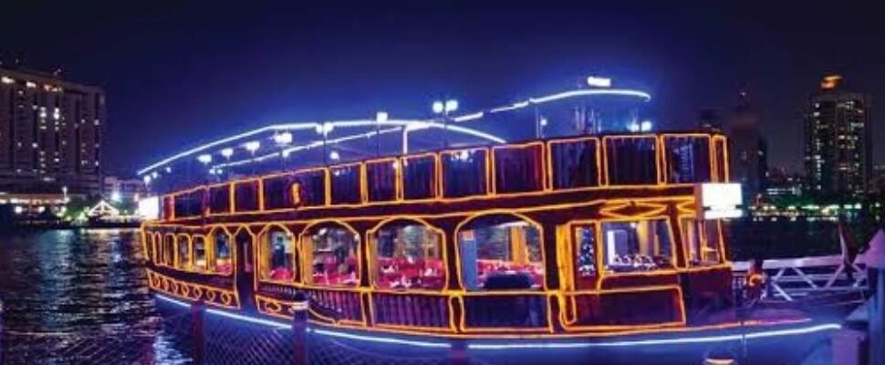 Traditional dhow sailing along Dubai Creek