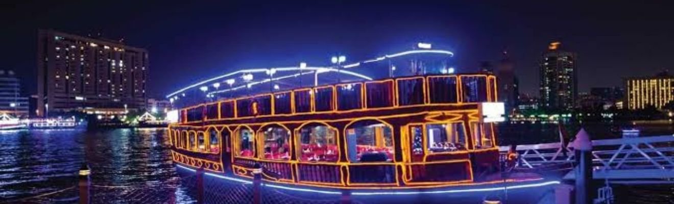 Traditional dhow sailing along Dubai Creek