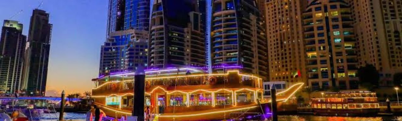 A luxury cruise ship sailing through Dubai Marina.