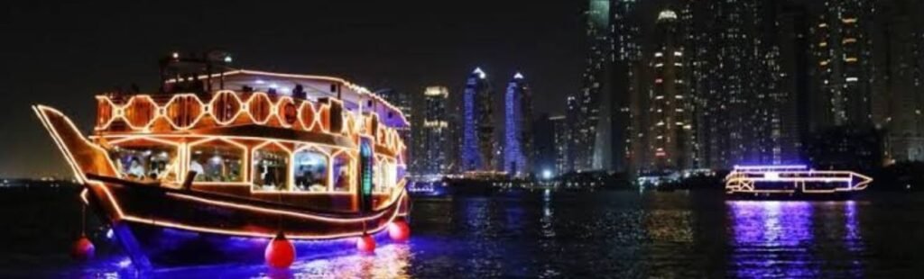 Dining setup on a cruise ship with a view of Dubai skyline.