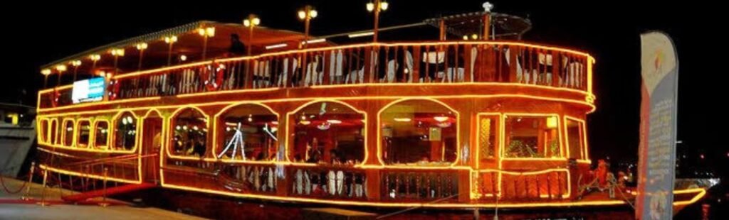 A couple enjoying a romantic moment on the dhow cruise.