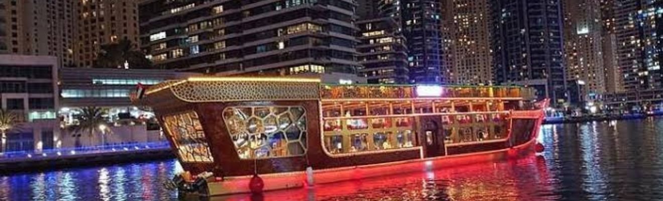 Solo traveler enjoying a serene view of Dubai Marina from the cruise deck.