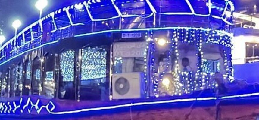 Dubai Marina with cruise boats docked at sunset.