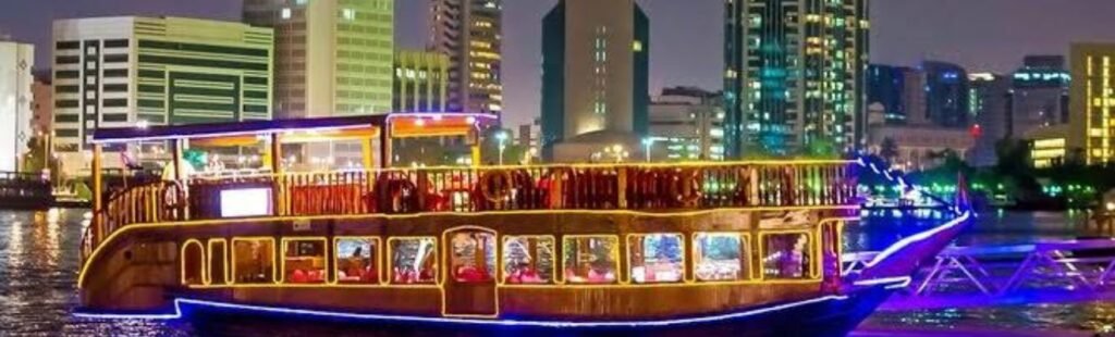 Guests capturing photos on the deck of the Marina Yacht Tour Dubai.