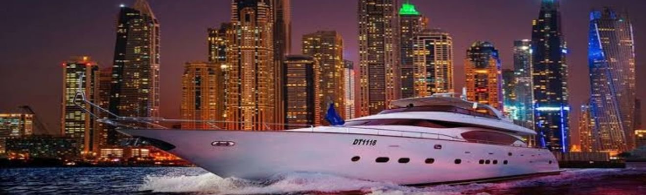 A luxury yacht cruising through Dubai Marina under a clear blue sky.