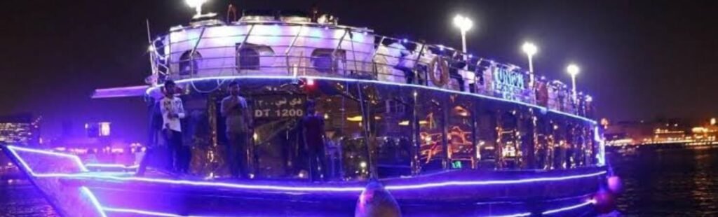 The vibrant nightlife of Dubai Marina viewed from a boat.