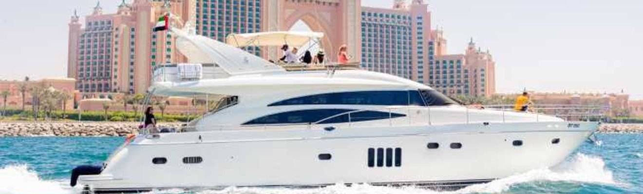 A luxury boat cruising through Dubai Marina at sunrise.