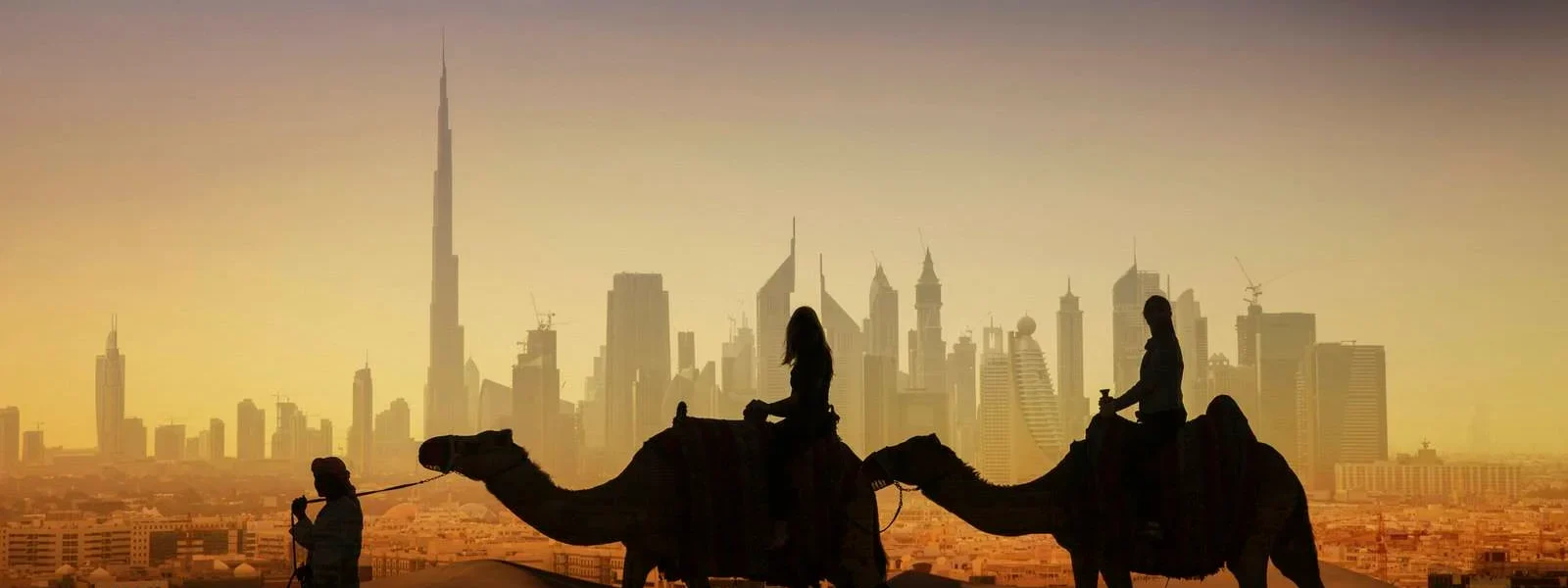 A thrilling evening desert safari in Dubai featuring dune bashing, camel rides, and a luxury Bedouin-style camp under the stars.