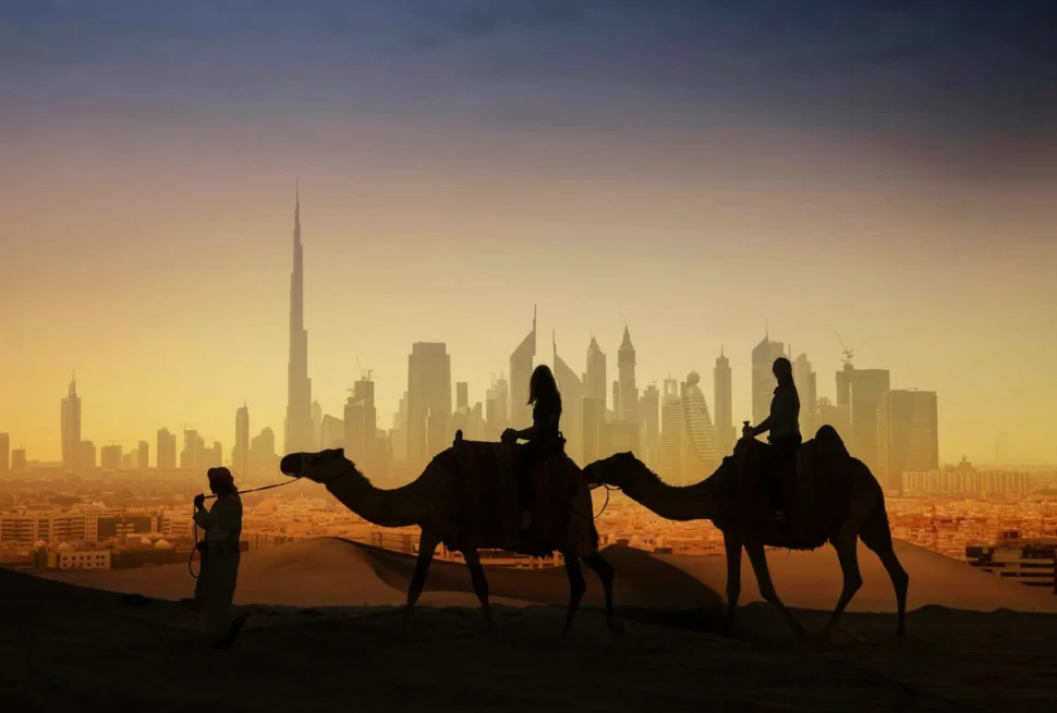 A thrilling evening desert safari in Dubai featuring dune bashing, camel rides, and a luxury Bedouin-style camp under the stars.