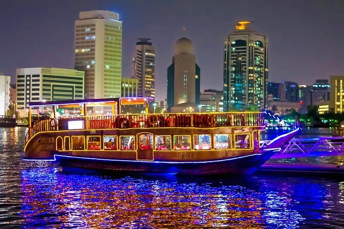 Beautifully lit traditional dhow sailing on Dubai Marina Dhow Cruise, offering a luxurious Marina Dhow Cruise with dinner and stunning city views in Marina Dhow Cruise Dubai.