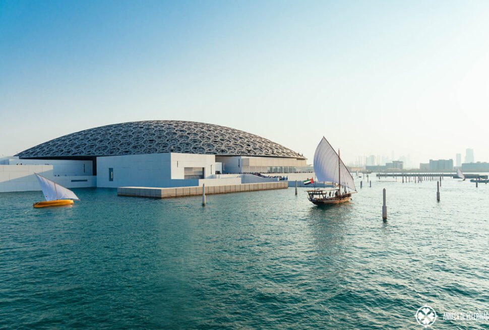 Stunning view of Louvre Abu Dhabi architecture, showcasing the iconic dome and waterfront design. Explore The Louvre Abu Dhabi and book Louvre Abu Dhabi tickets for an unforgettable cultural experience.