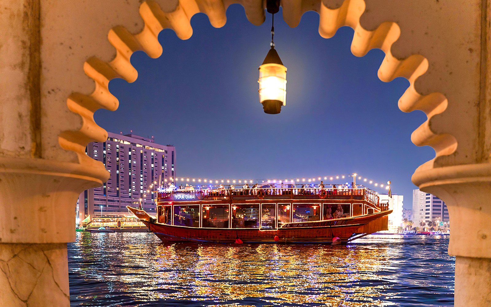 Dubai Creek Dhow Cruise with scenic views, enjoying a cruise dinner in Dubai while sailing through the iconic Dubai Creek.