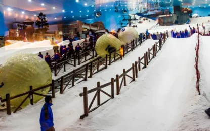 Visitors enjoying snowy adventures inside Ski Dubai, featuring skiing slopes and snow activities included in special Ski Dubai offers with ticket purchase.