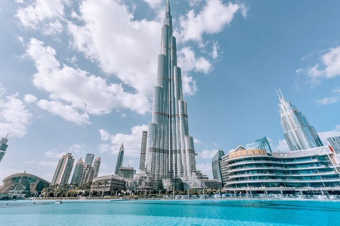 A breathtaking view from the top of Burj Khalifa with visitors enjoying the skyline – your ultimate guide to Dubai Burj Khalifa tickets and Burj Khalifa Tickets.