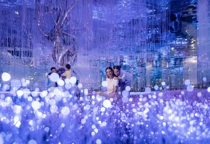 Entrance of AYA Universe in Dubai showing location details, visitor timings, and ticket information.