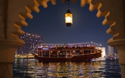 Scenic Dhow Cruise Dubai at night, gliding through Dubai Marina, offering stunning skyline views, fine dining, and a magical experience on the water.