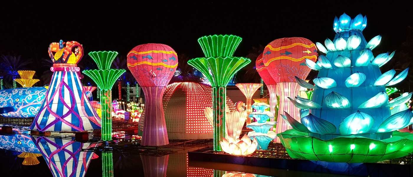 Colorful illuminated sculptures at Dubai Garden Glow at night, highlighting the latest Dubai Garden Glow ticket price, entry tickets, and updated park timings.