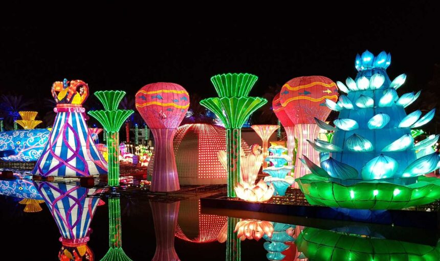 Colorful illuminated sculptures at Dubai Garden Glow at night, highlighting the latest Dubai Garden Glow ticket price, entry tickets, and updated park timings.