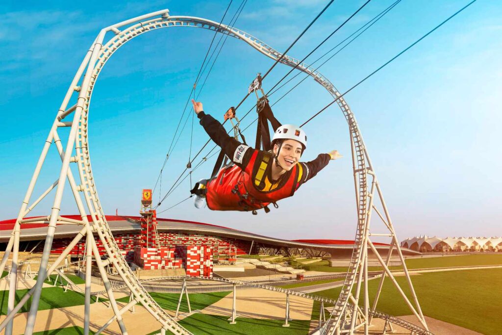 Flying Aces Adventure – Ferrari Theme Park Abu Dhabi › Forever Tourism LLC Visitor enjoying the Flying Aces zip line ride at Ferrari Theme Park Abu Dhabi.