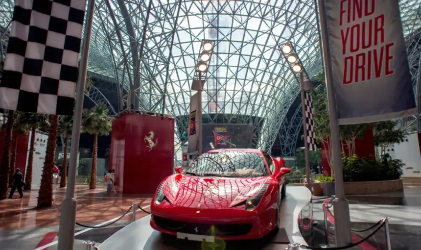 Ferrari Car Display – Inside Ferrari Theme Park Abu Dhabi › Forever Tourism LLC Iconic red Ferrari car display inside Ferrari Theme Park Abu Dhabi.