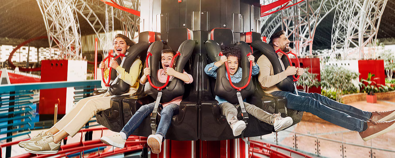 Thrilling amusement ride at Ferrari World Yas Island featuring the high-speed Formula Rossa and the gravity-defying Flying Aces roller coaster.