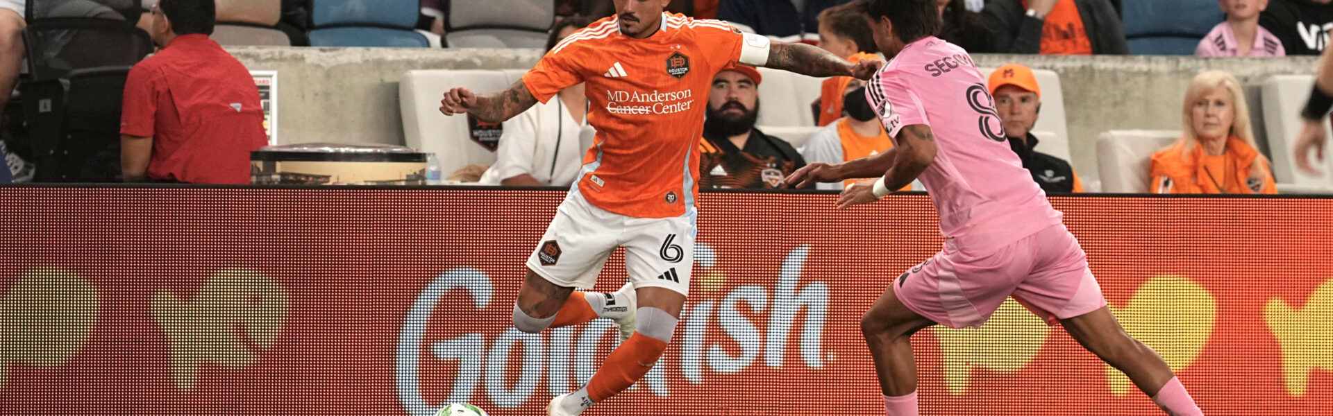 Fans cheering at a packed stadium during an intense Houston Dynamo vs Inter Miami match, showcasing the excitement of Houston Dynamo vs Inter Miami tickets and live-action moments.