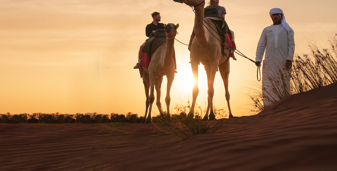 4x4 vehicle driving through sand dunes during a Dubai desert safari – part of the best desert tour Dubai experience.