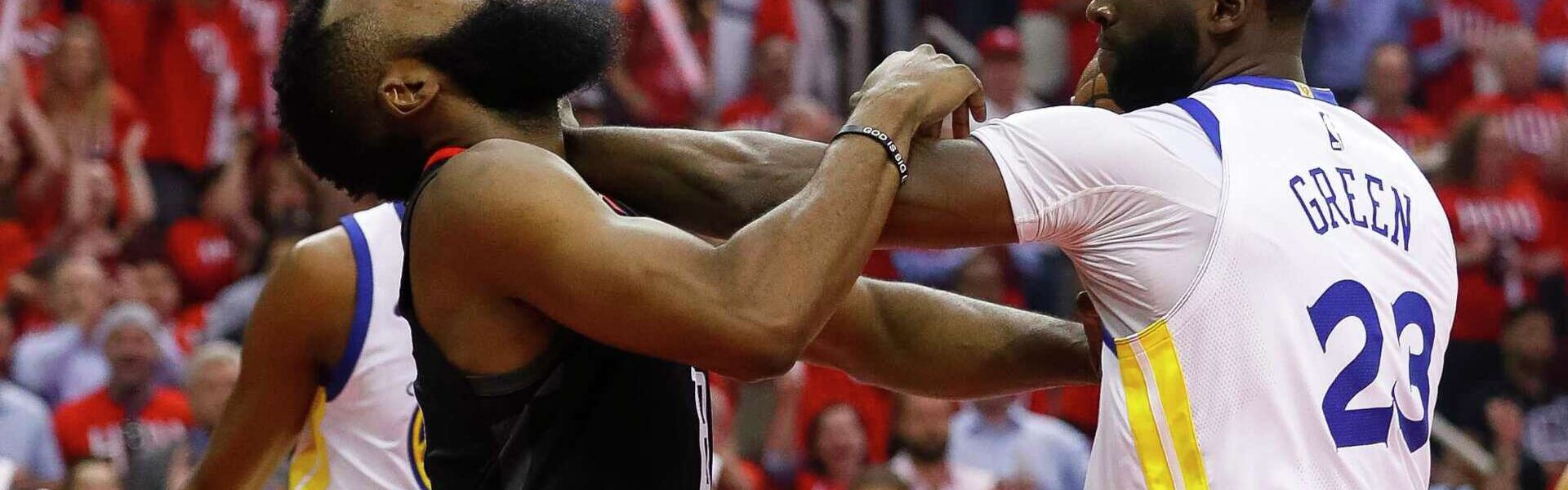 Fans cheering during the Rockets vs Warriors NBA game in Texas—apply for your USA visa to experience the thrill of live NBA games.