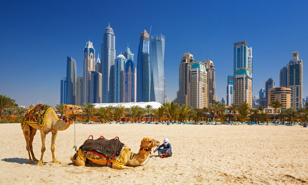 Tourists enjoying a Dubai tour package exploring famous Dubai City landmarks like Burj Khalifa, Dubai Marina, and traditional souks with guided city tour packages.