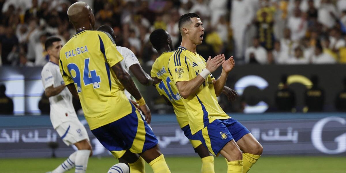 Fans cheering during the intense Al-Hilal vs Al-Nassr match – check lineups and get your Saudi visa to secure tickets for the next big game.