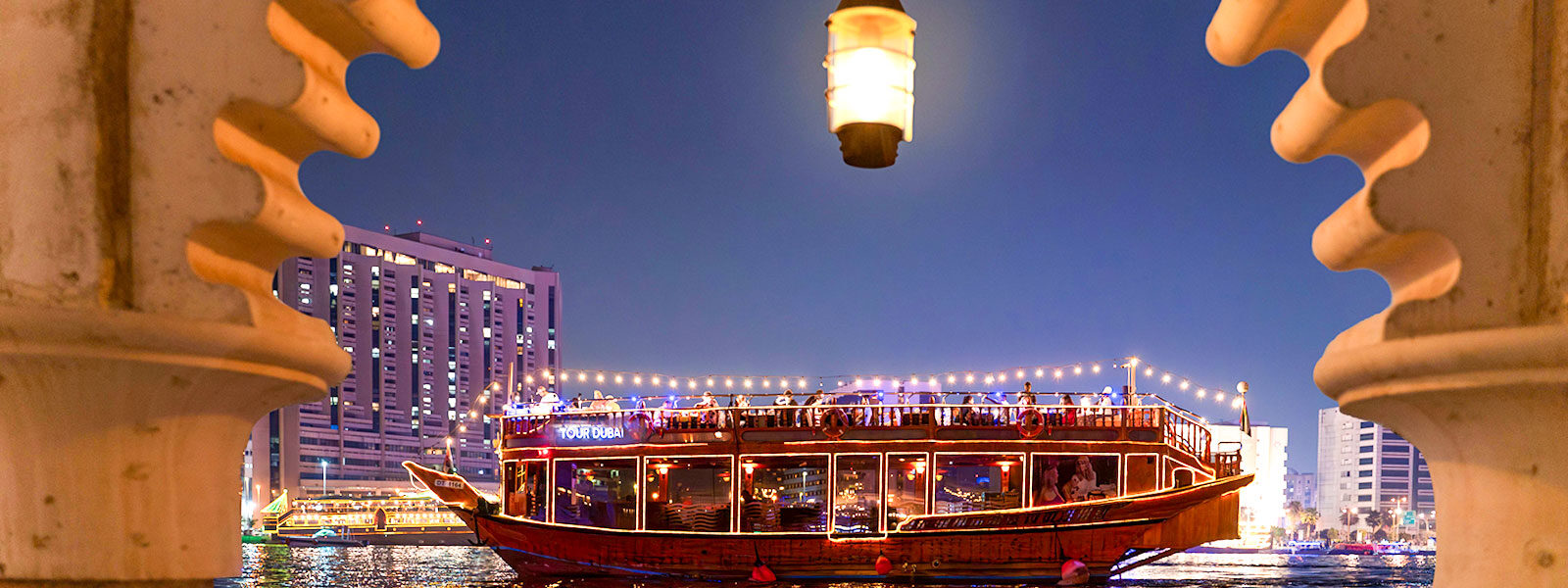 Dhow Dinner Cruise in Dubai, featuring stunning views of Ain Dubai and Dubai Marina, showcasing the best dhow cruise experience.