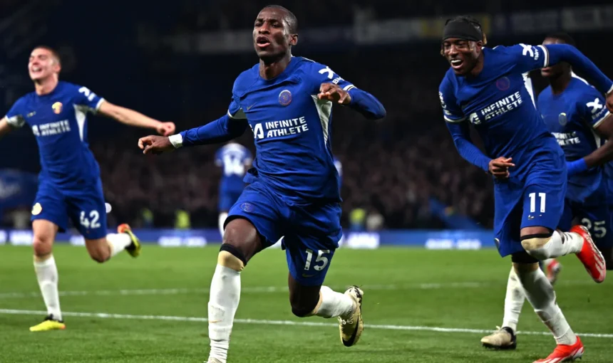 Chelsea vs Tottenham match in action showing players from both teams competing at a packed stadium.