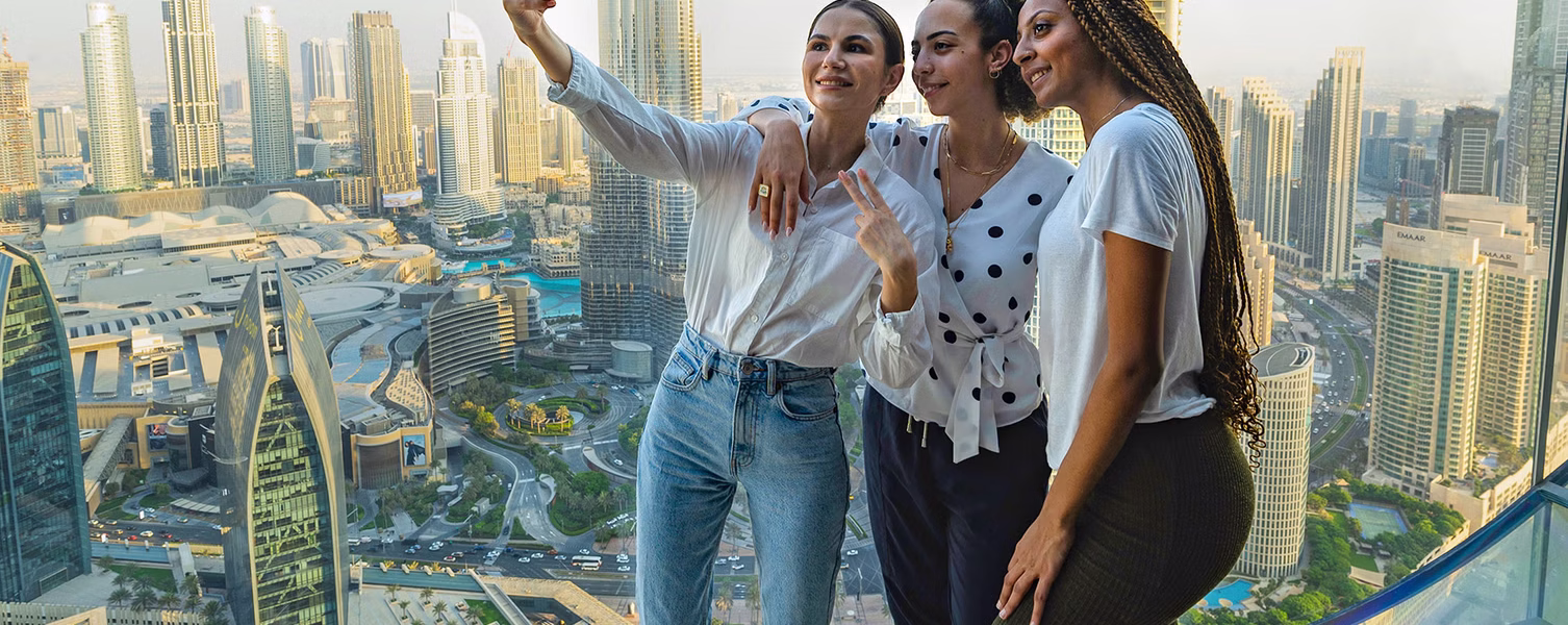 Dubai City Tour – What Most Tourists Miss! › Forever Tourism LLC Skyline view of Dubai City Tour featuring Dubai Mall, Burj Khalifa, and Palm Jumeirah landmarks.