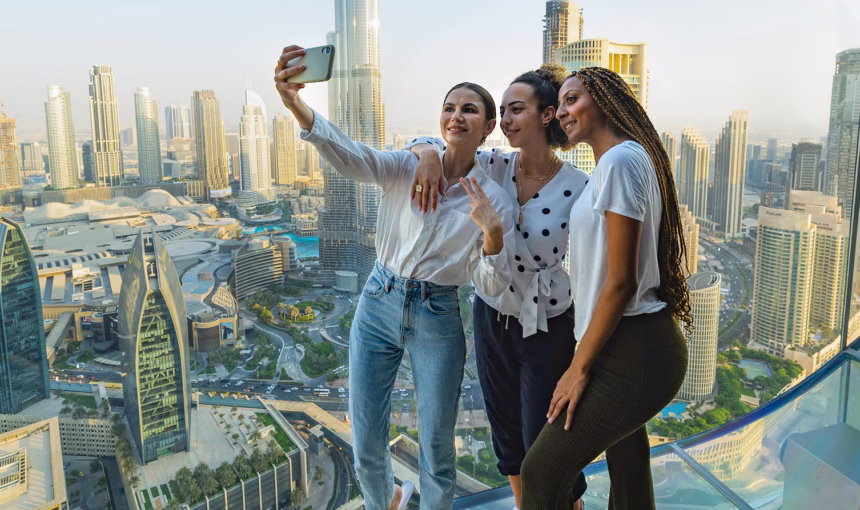 Tourists enjoying a Dubai city tour with views of Burj Khalifa, showcasing popular places to visit in Dubai and exclusive Burj Khalifa tickets offers.