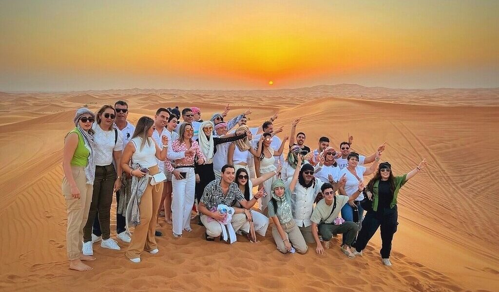 Tourists enjoying a Morning Desert Safari as part of exciting Dubai Desert Safari deals in the golden sands of Desert Safari Dubai.