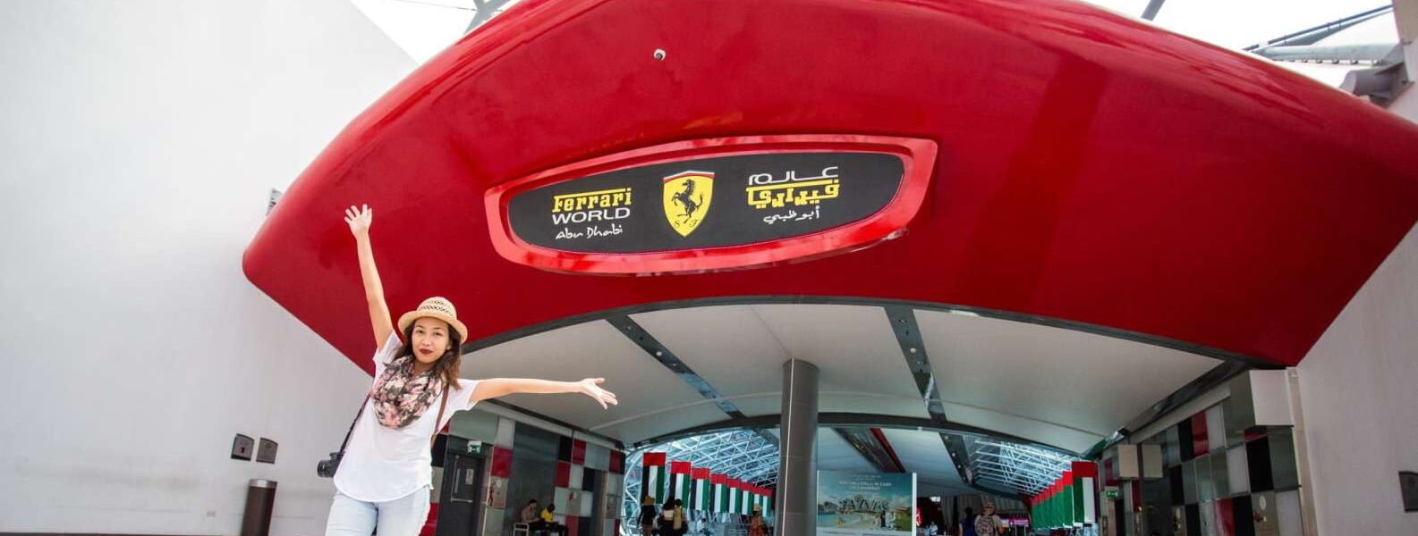 Tourists enjoying an Abu Dhabi city tour with Ferrari World, exploring Yas World attractions and iconic landmarks during a City Tour Abu Dhabi experience.