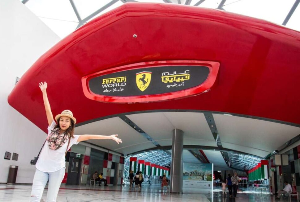 Tourists enjoying an Abu Dhabi city tour with Ferrari World, exploring Yas World attractions and iconic landmarks during a City Tour Abu Dhabi experience.