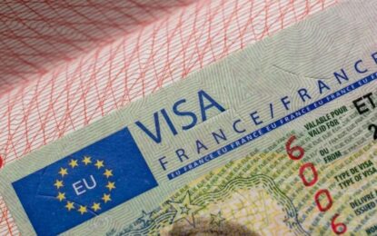 Passport with France visa stamp and travel documents representing the France visa application and tourist visa process.