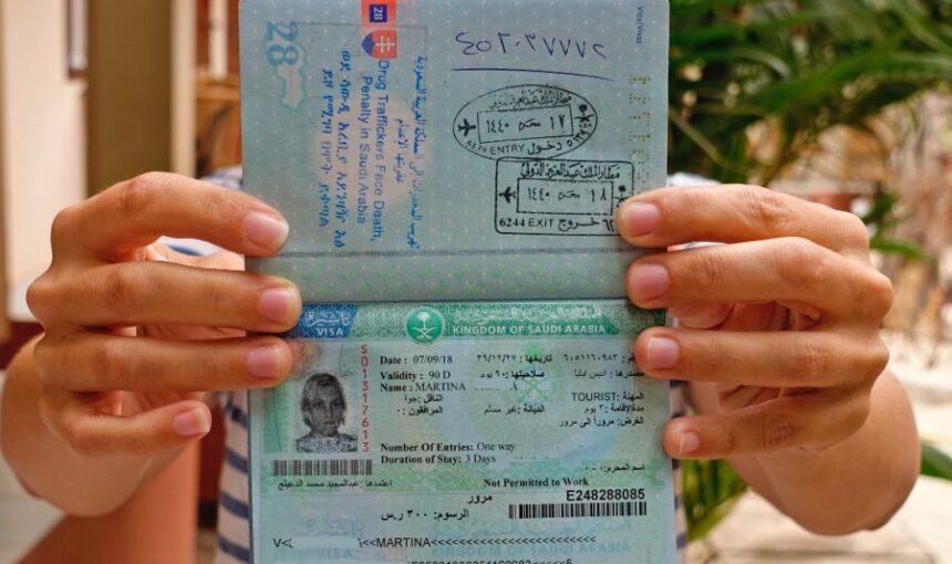 Tourist Visa Saudi Arabia – Quick Approval Guide Inside › Forever Tourism LLC Travelers reviewing Saudi visa restrictions and requirements for tourist visa Saudi Arabia at an airport or visa center.