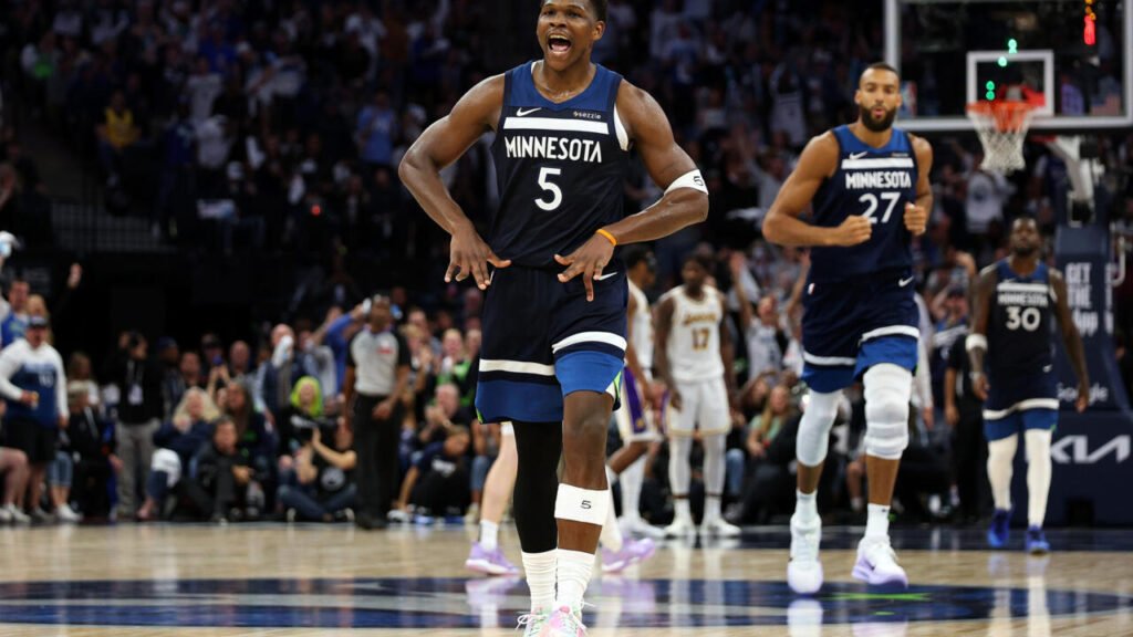 Lakers vs Timberwolves – Don’t Miss the Next Tip-Off! › Forever Tourism LLC Fans cheering at a Lakers vs Timberwolves game, highlighting the excitement of NBA matches and the chance to get a USA visa to witness the next showdown live.