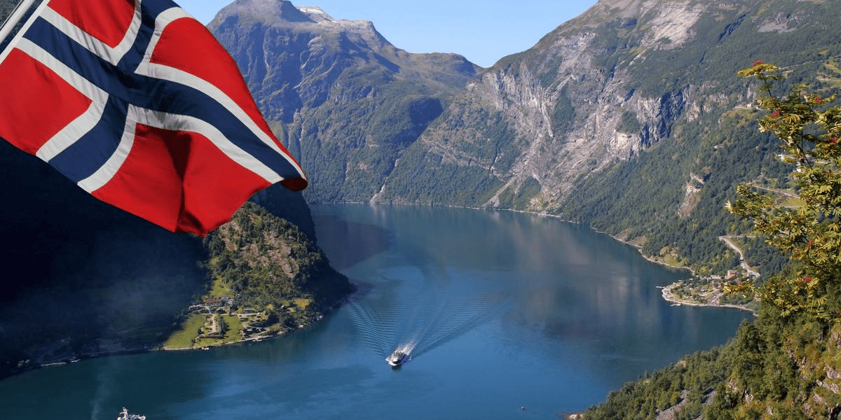 Passport with Schengen visa stamp representing easy approval for Norway visa from Dubai for travel across Norway and the Schengen zone.